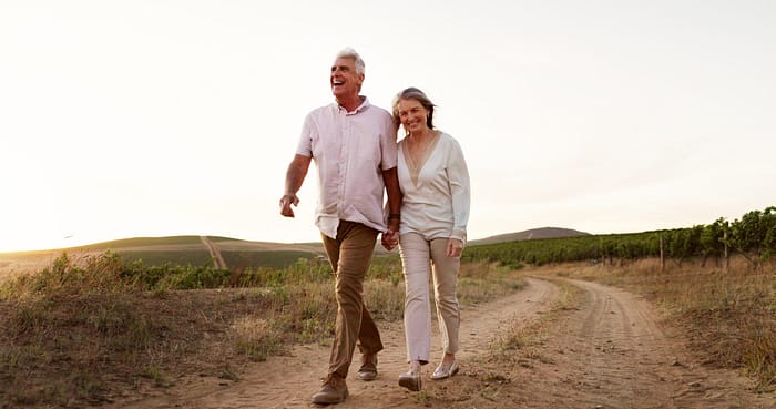 Couple walking, enjoying being pain free